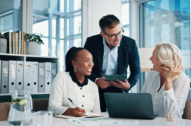 Three colleagues having a meeting at work.